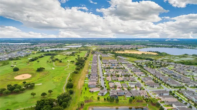 an aerial view of residential building with outdoor space and lake view