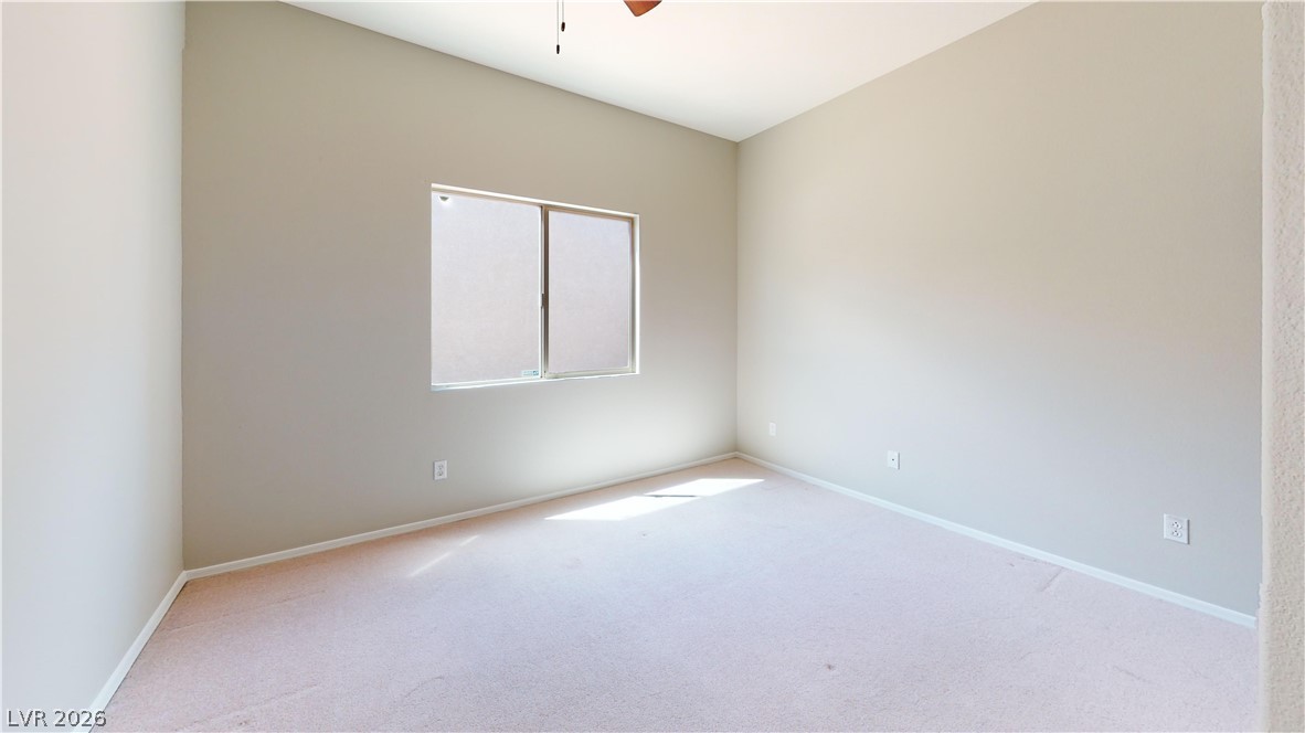 3591 Driving Range Street Las Vegas, NV 89122 - Photo 72 of 79 This spacious room offers comfort and versatility for various living arrangements.