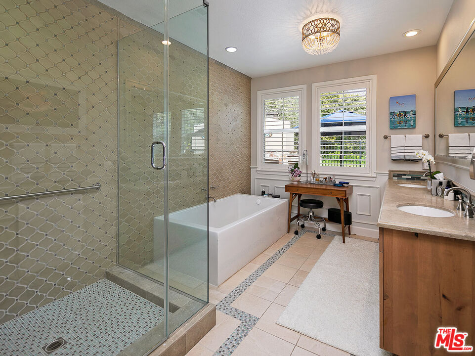 6372 Lagunitas Court Carpinteria, CA 93013 - Photo 12 of 19 a spacious bathroom with a tub a sink and a shower