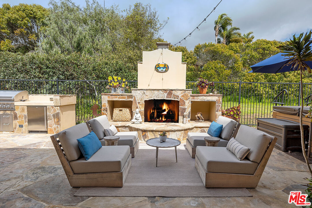 6372 Lagunitas Court Carpinteria, CA 93013 - Photo 5 of 19 a outdoor living space with furniture and a fireplace