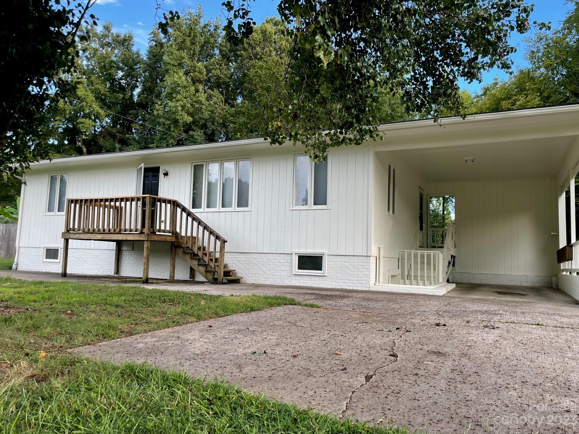 5700 Hickory Grove Road Charlotte, NC 28215 - Photo 2 of 7 a view of a house with a yard