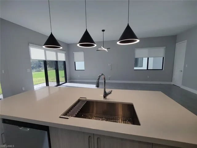 a view of a field with an trees in the background