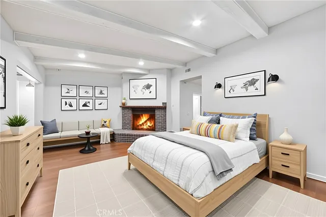 a bedroom with a large bed and a couch