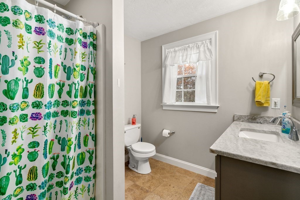 10 Brook Hill Road Sturbridge, MA 01518 - Photo 27 of 35 a bathroom with a sink a toilet and a window