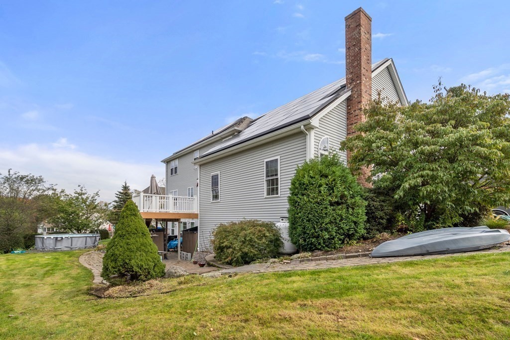 10 Brook Hill Road Sturbridge, MA 01518 - Photo 5 of 35 a view of a house with backyard and trees
