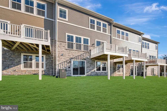 a large building with a yard in front of it