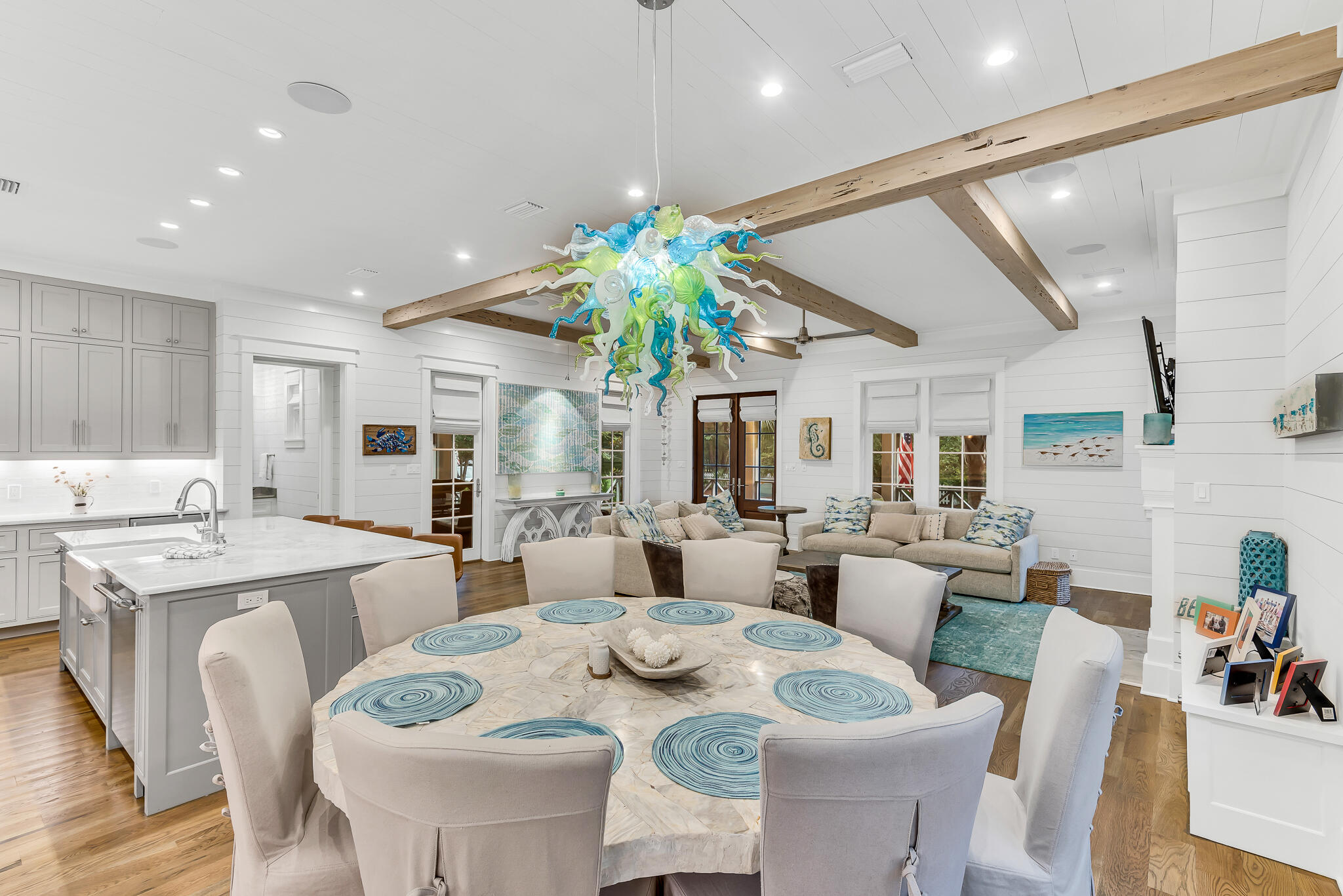 57 Salt Box Lane West Inlet Beach, FL 32461 - Photo 11 of 74 a view of a dining room with furniture a potted plant and wooden floor