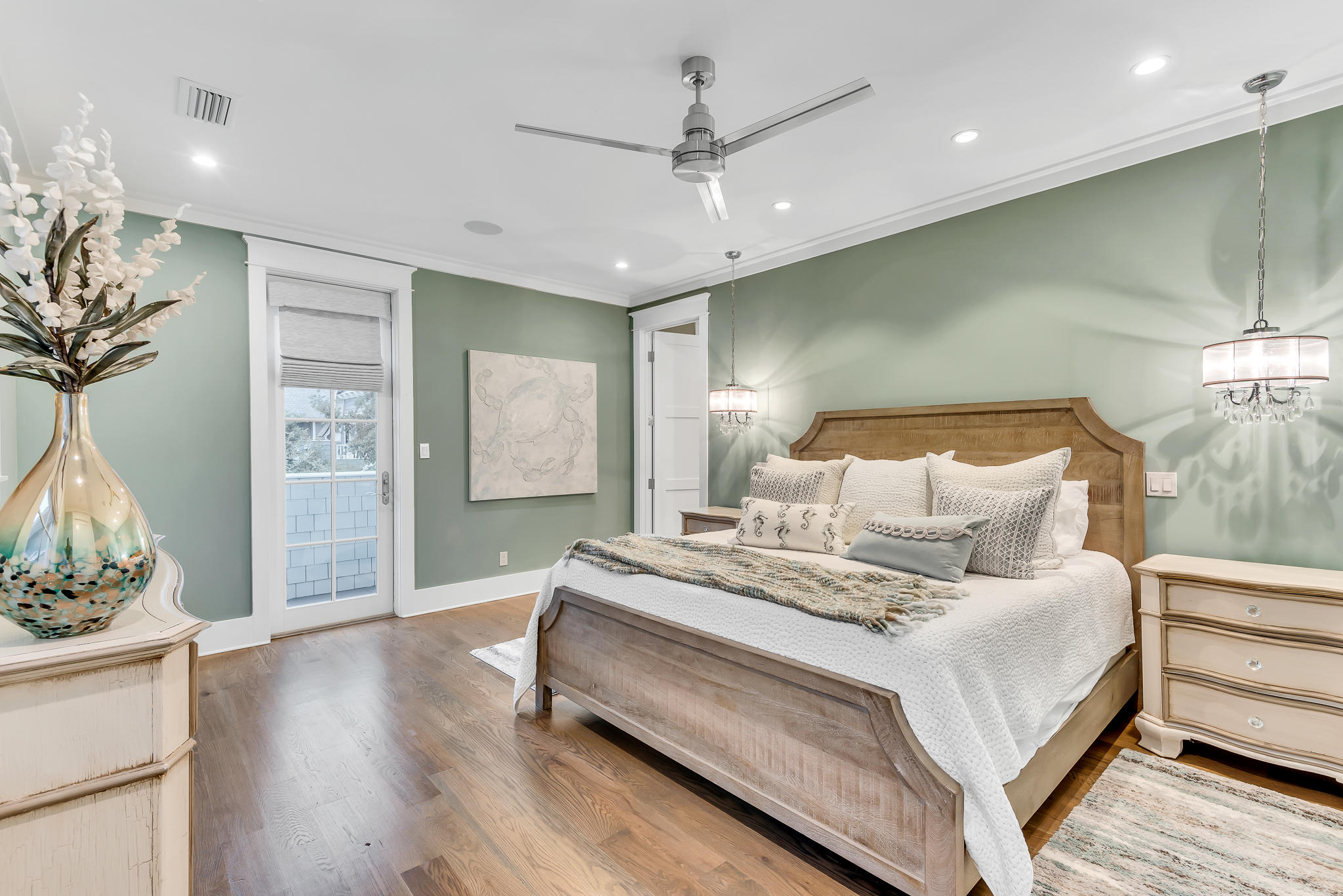 57 Salt Box Lane West Inlet Beach, FL 32461 - Photo 22 of 74 a spacious bedroom with a bed and a chandelier