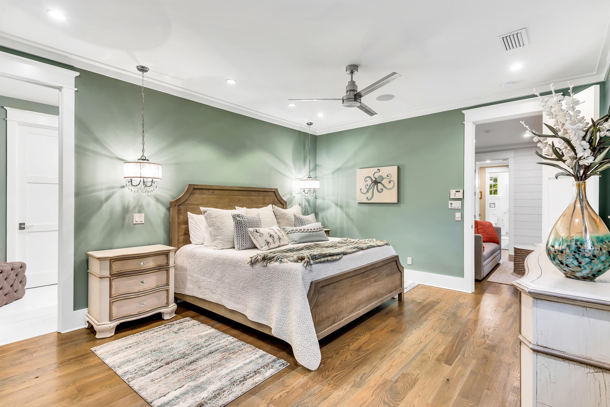 57 Salt Box Lane West Inlet Beach, FL 32461 - Photo 24 of 74 a spacious bedroom with a bed and a chandelier