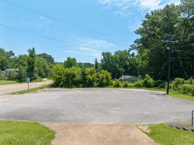 a view of a road with a building in the background