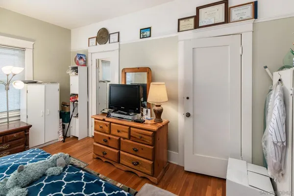 a view of a hallway with entryway and furniture