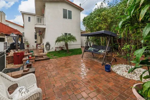 a backyard of a house with seating space