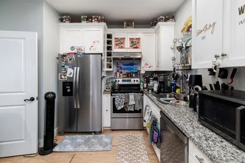 a room with furniture and a flat screen tv