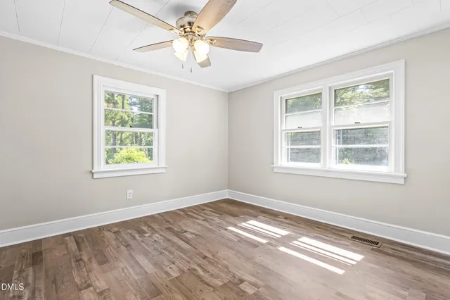 a view of empty room with windows