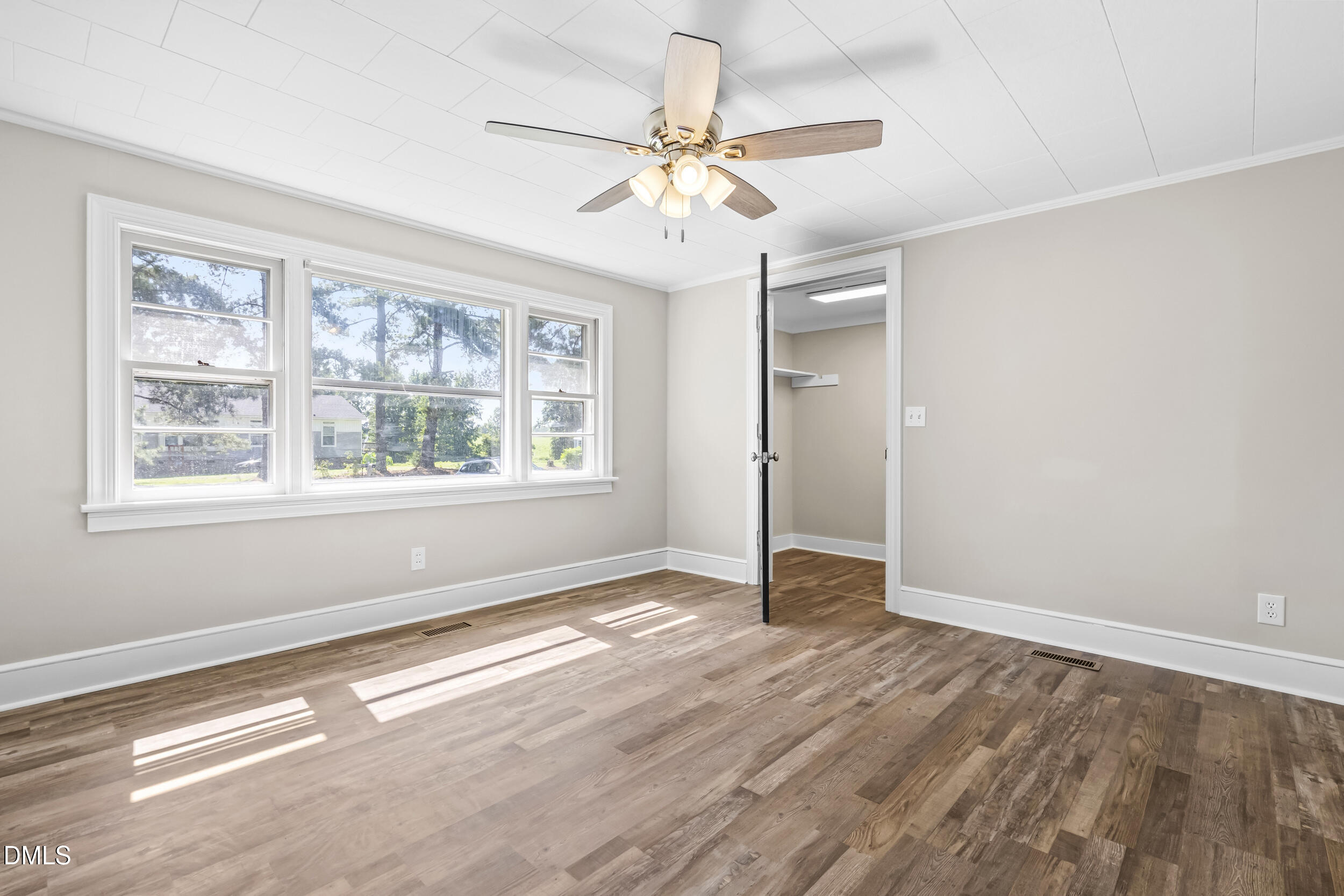 5511 Flower Hill Road Kenly, NC 27542 - Photo 13 of 33 wooden floor in an empty room with a window