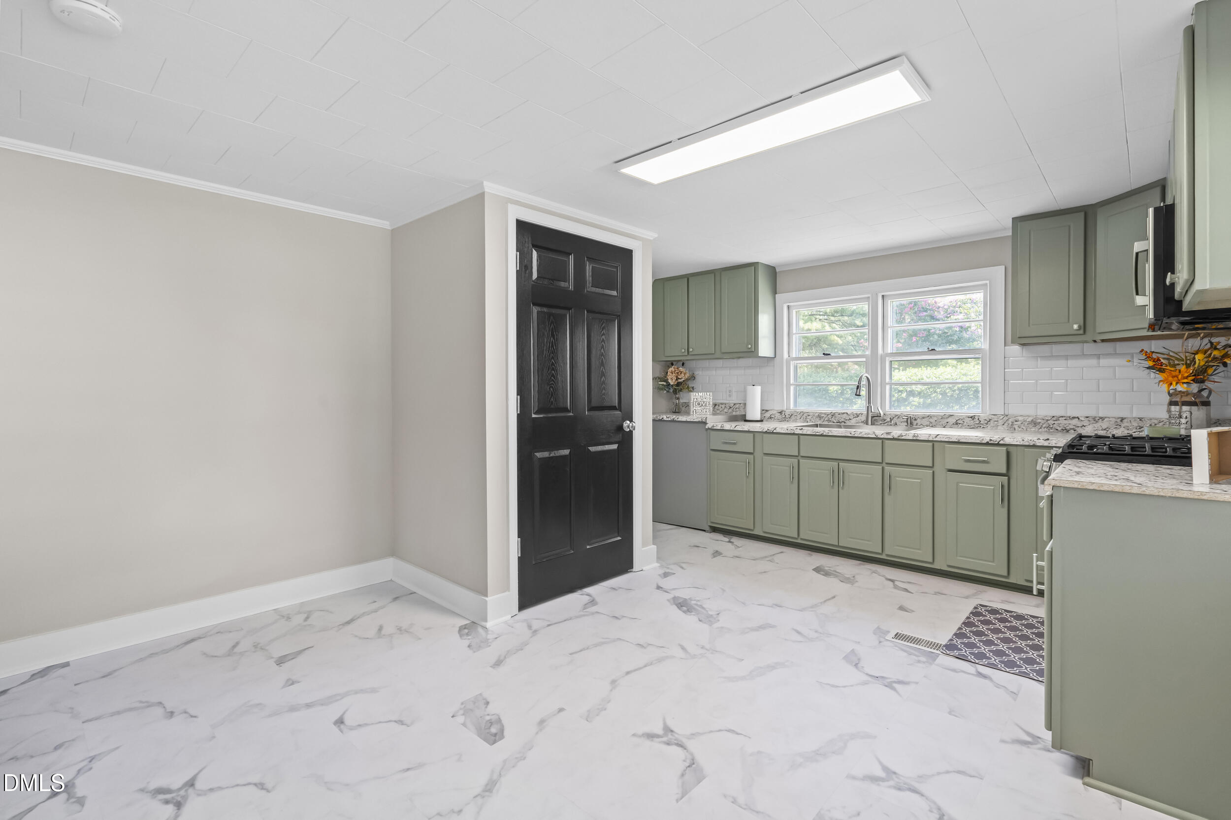 5511 Flower Hill Road Kenly, NC 27542 - Photo 17 of 33 a kitchen with stainless steel appliances granite countertop a sink stove and refrigerator