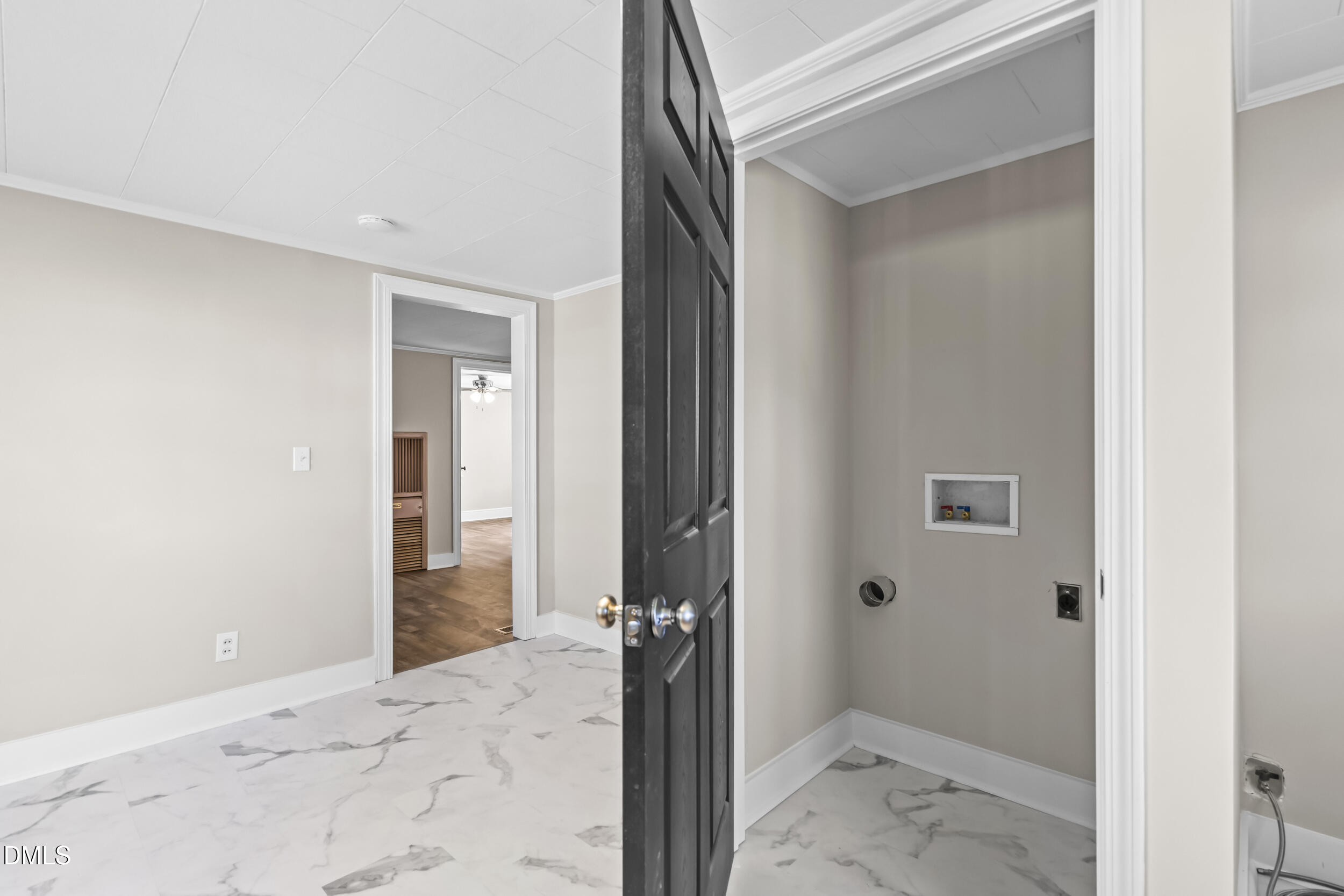 5511 Flower Hill Road Kenly, NC 27542 - Photo 21 of 33 a view of a hallway with a livingroom and bathroom space