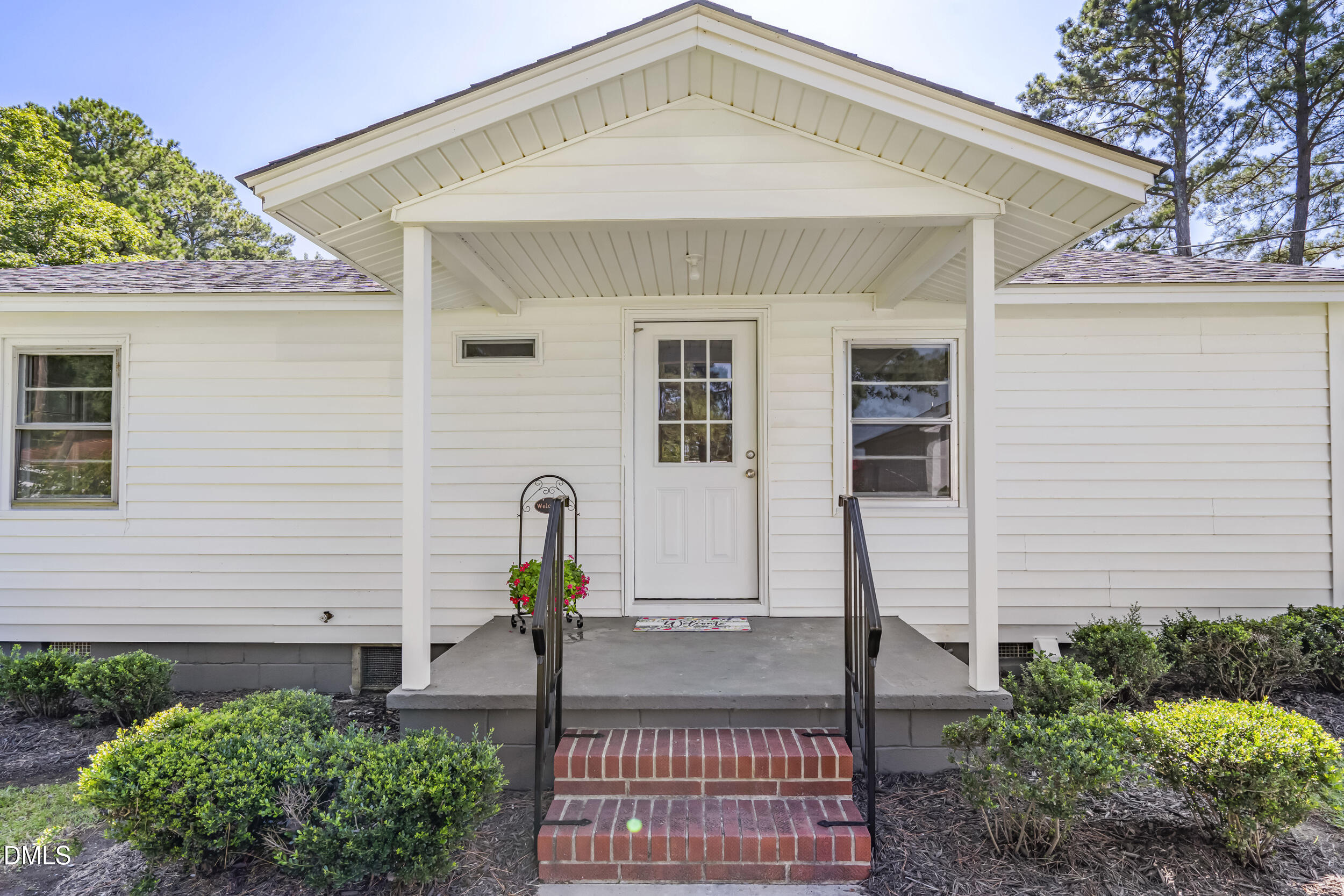 5511 Flower Hill Road Kenly, NC 27542 - Photo 22 of 33 a front view of a house with garden