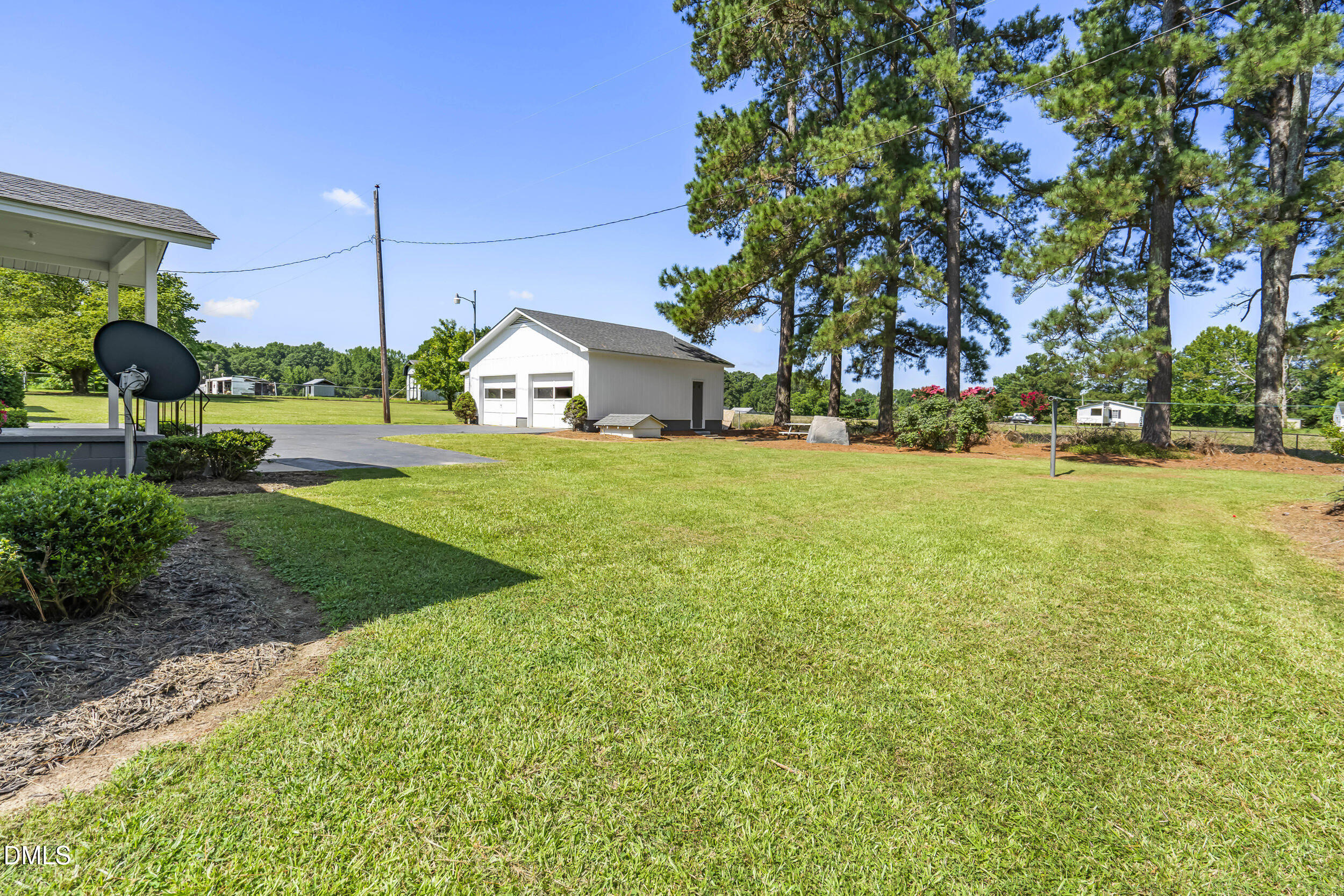 5511 Flower Hill Road Kenly, NC 27542 - Photo 23 of 33 a front view of a house with garden