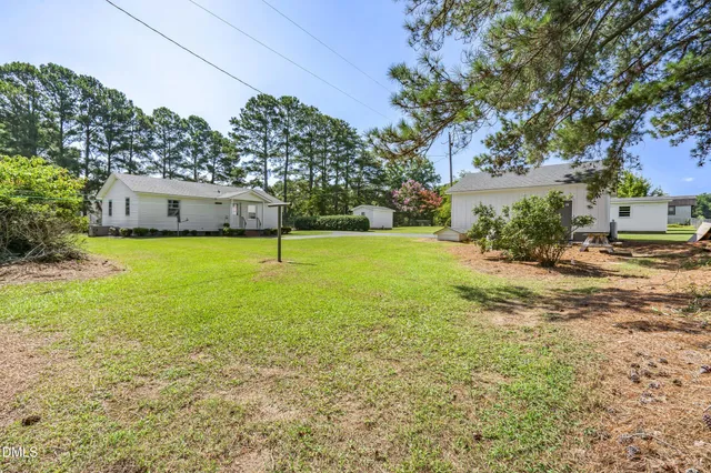 a backyard of a house with lots of green space