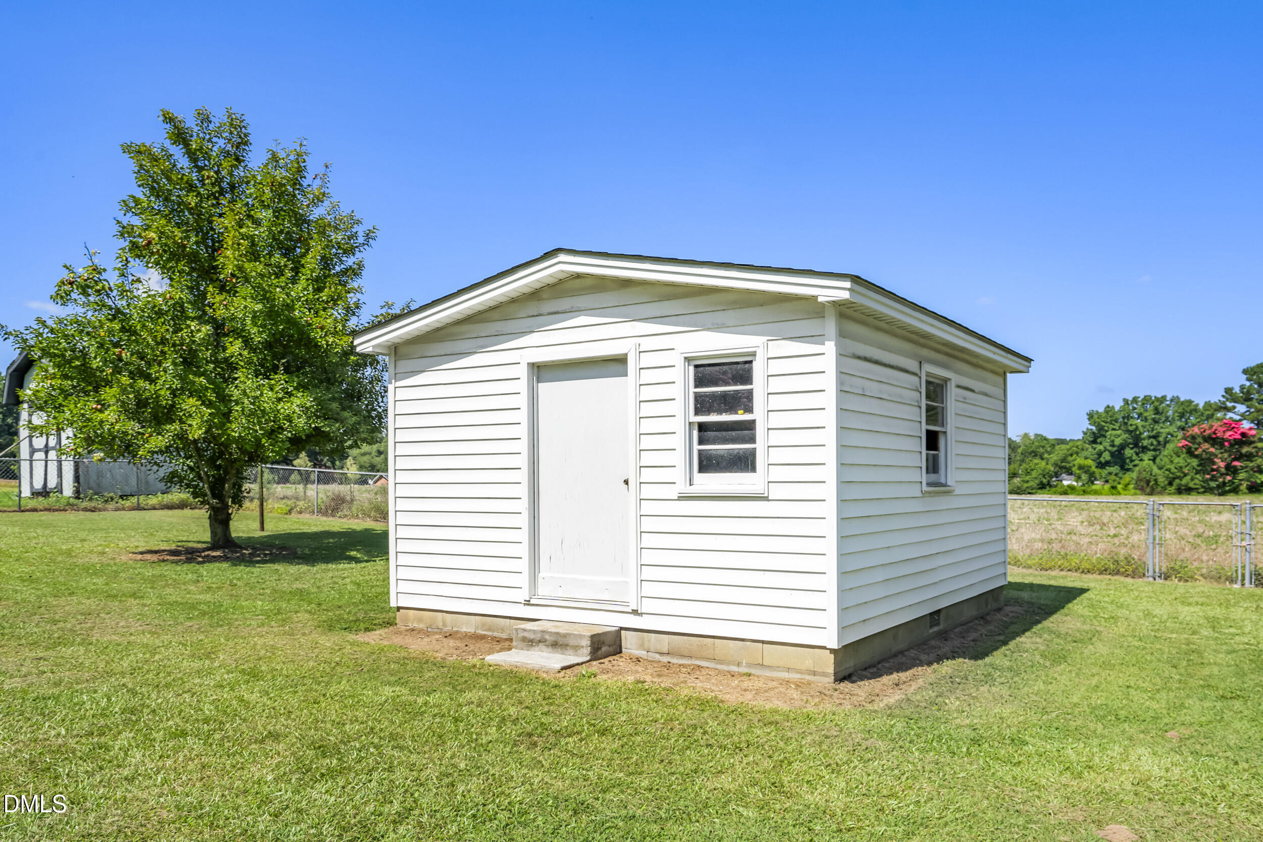 5511 Flower Hill Road Kenly, NC 27542 - Photo 28 of 33 a front view of a house with a yard