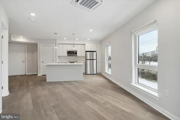 a view of kitchen with wooden floor