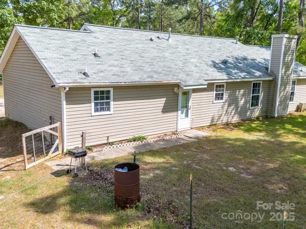 a view of backyard with a garden and entertaining space