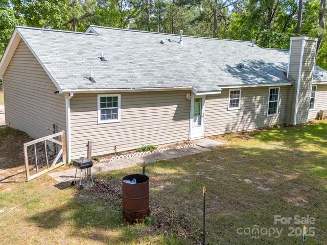 a view of backyard with a garden and entertaining space