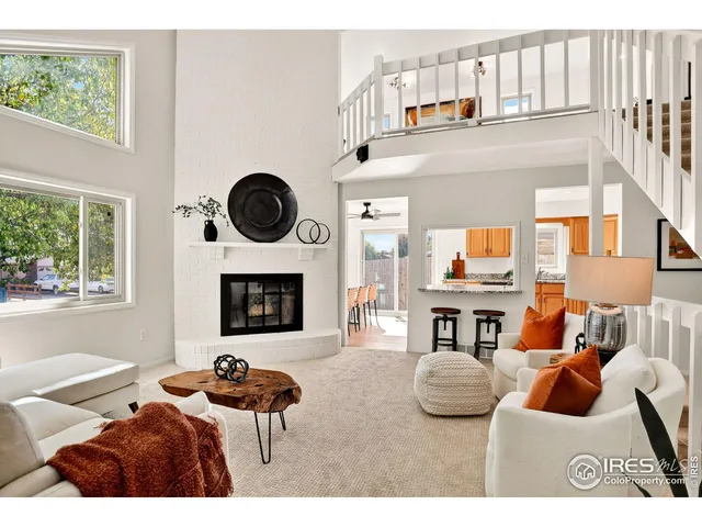 a bedroom with furniture and a fireplace