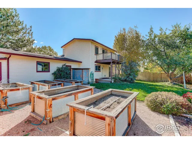 a view of a house with pool table and chairs