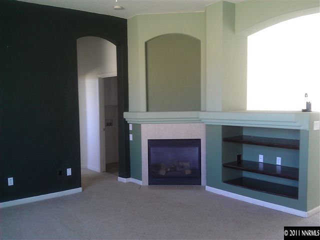 5040 Coggins Road Reno, NV 89506 - Photo 4 of 6 a living room with furniture and a fireplace