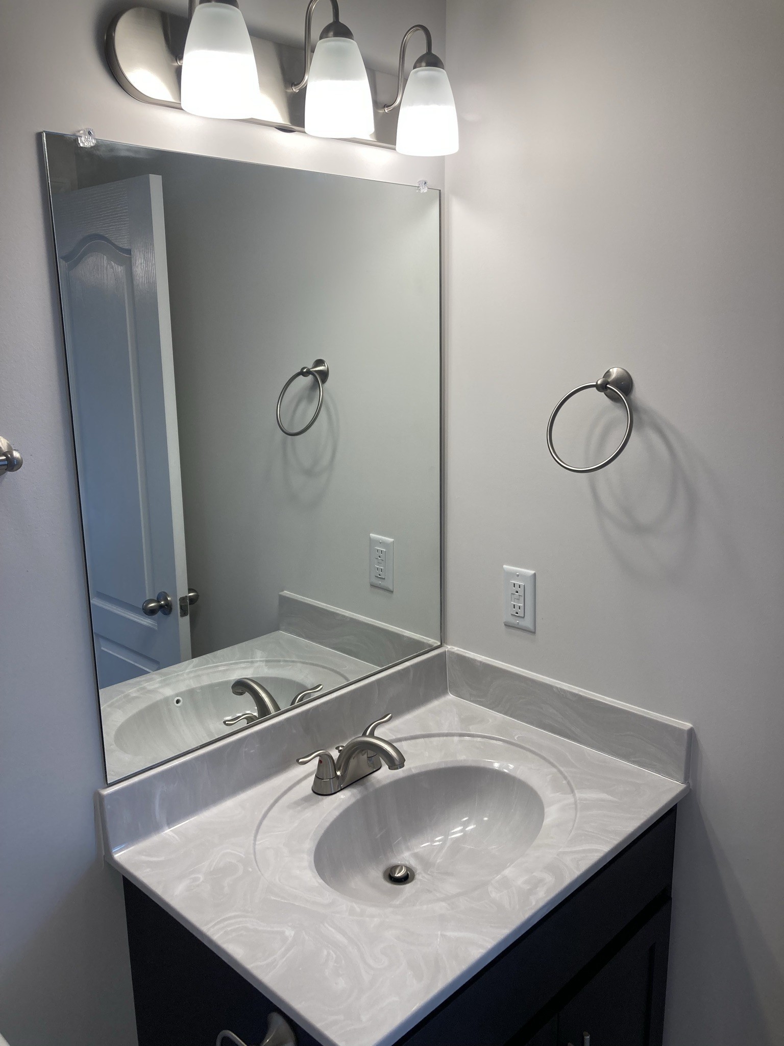 914 Peachers Mill Road, Unit E Clarksville, TN 37042 - Photo 22 of 30 a bathroom with a sink and a mirror