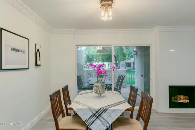 a living room with furniture and flowers