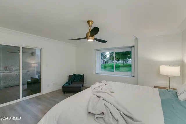 a bathroom with a granite countertop sink a toilet and shower