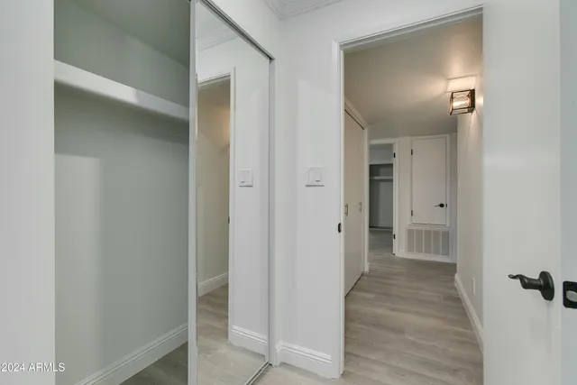 a view of a livingroom with furniture and a wooden floor