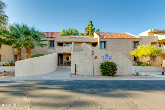 a view of backyard with a tub and trees