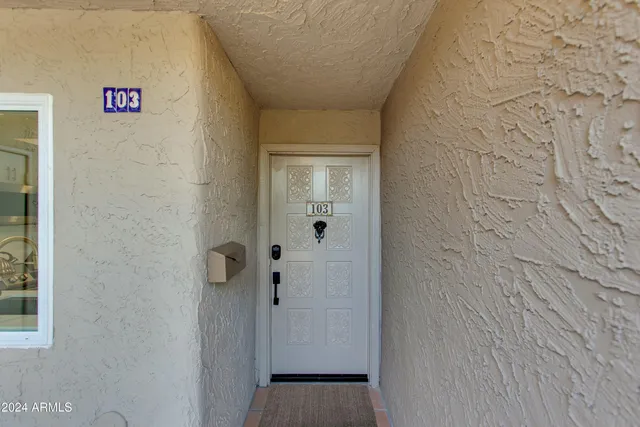 a view of living room kitchen with furniture and fireplace
