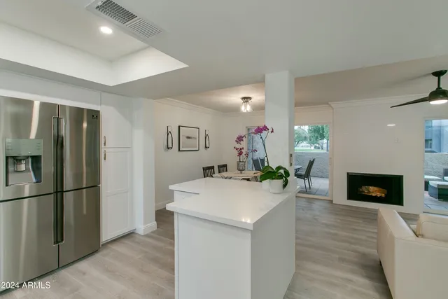 a kitchen with a refrigerator stove and sink