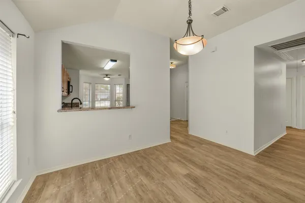 a view of a room with wooden floor and staircase