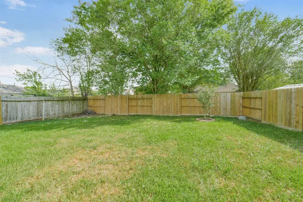 a view of a backyard with green space