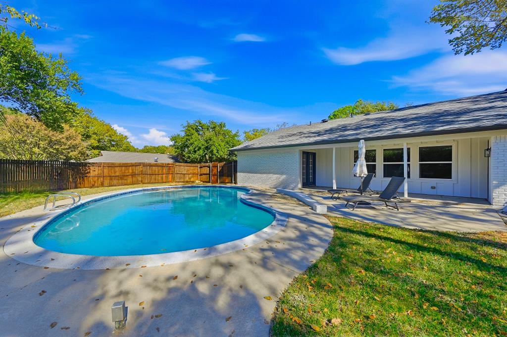 a view of a house with swimming pool