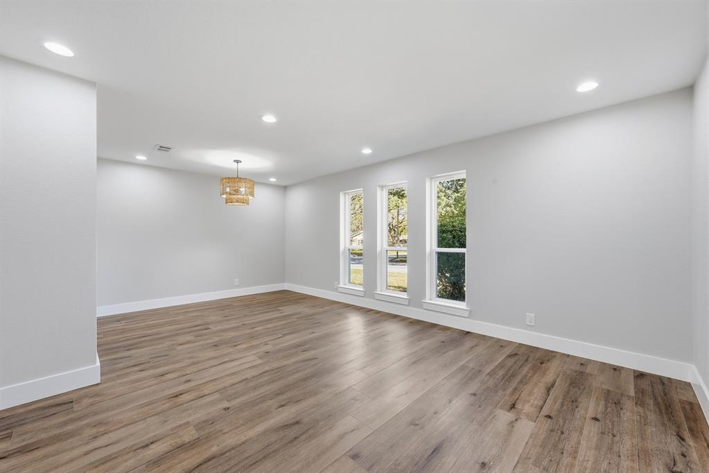 1145 Terrace Trail Hurst, TX 76053 - Photo 20 of 36 a view of an empty room with wooden floor and a window