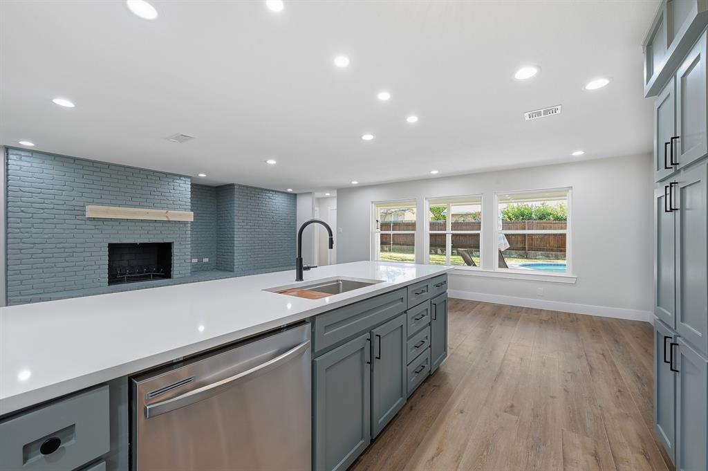1145 Terrace Trail Hurst, TX 76053 - Photo 9 of 36 a kitchen with a sink and a stove