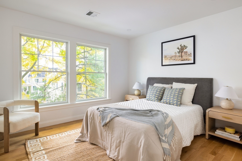 85 Naples Road, Unit 2 Brookline, MA 02446 - Photo 14 of 28 a bedroom with a bed and a large window
