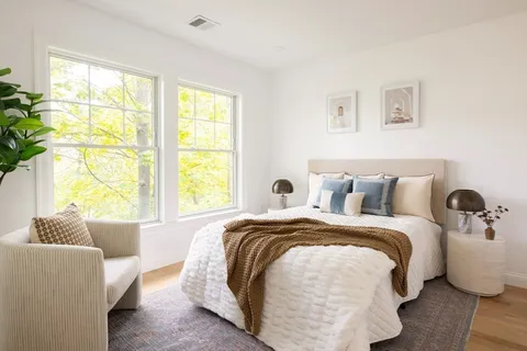 a bed room with a bed and a couch