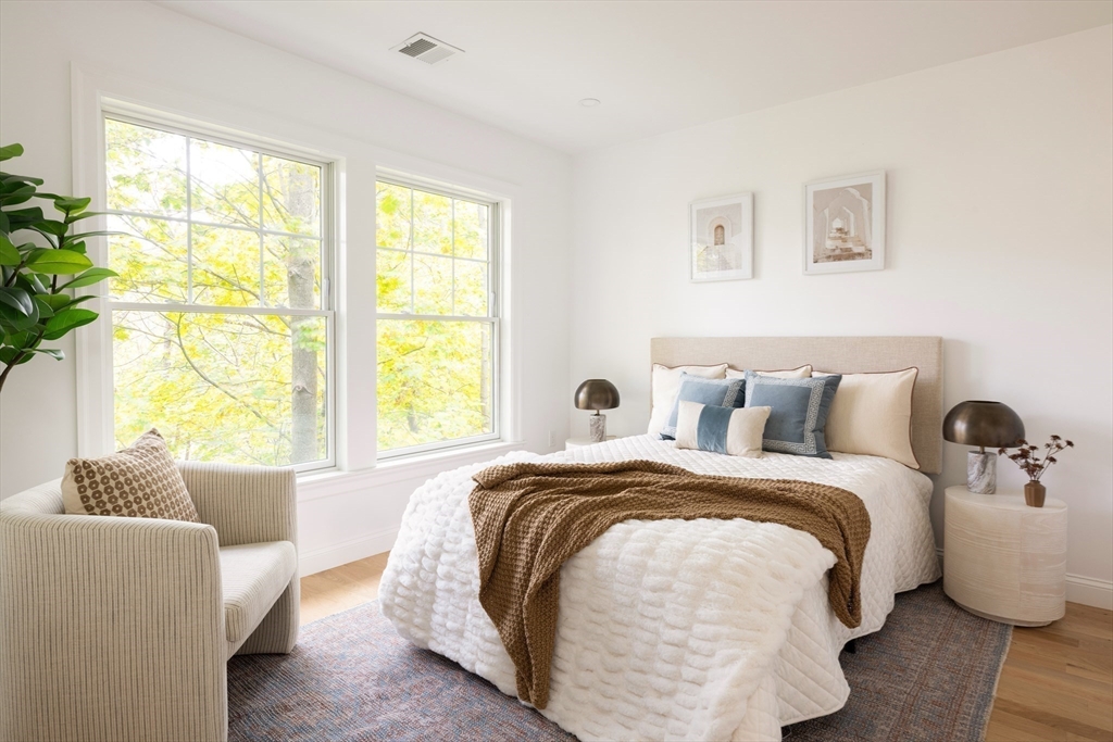 85 Naples Road, Unit 2 Brookline, MA 02446 - Photo 17 of 28 a bed room with a bed and a couch