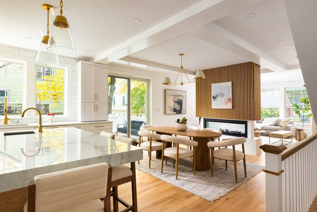 85 Naples Road, Unit 2 Brookline, MA 02446 - Photo 4 of 28 a room with lots of tables a large window and chairs