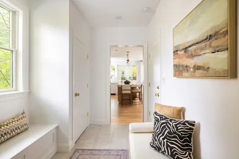 a living room with furniture and a gate