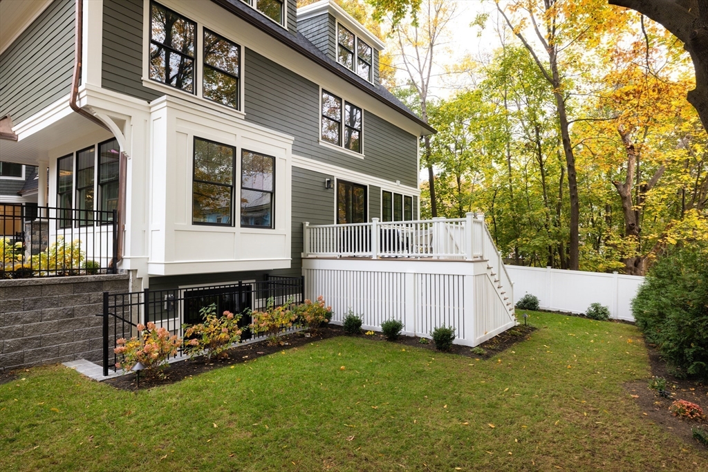 85 Naples Road, Unit 2 Brookline, MA 02446 - Photo 9 of 28 a front view of a house with a yard