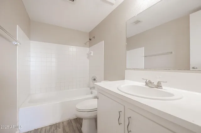 a bathroom with a sink a toilet and a bathtub